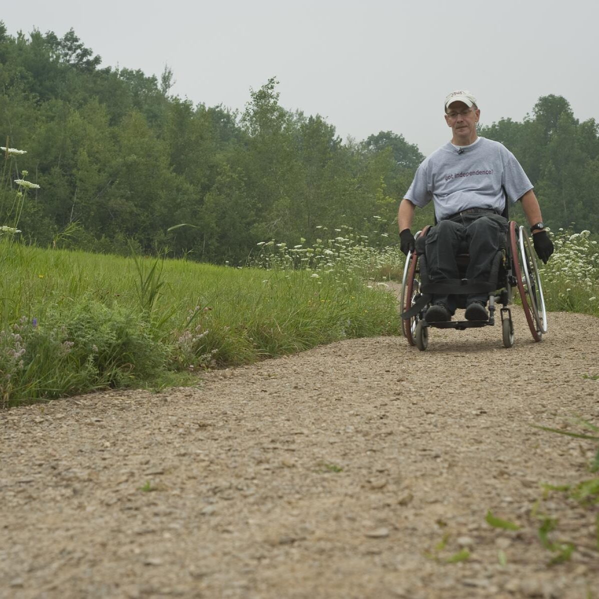 Man in wheelchair on hiking trail